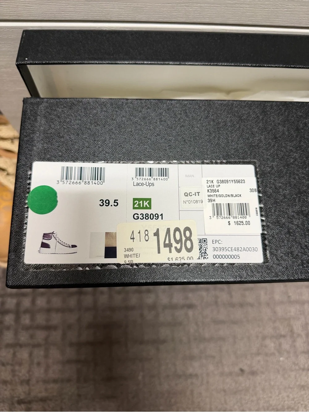 CHANEL White and Black High-Top Logo Sneaker